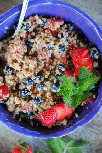 Seasonal quinoa salad in a purple bowl